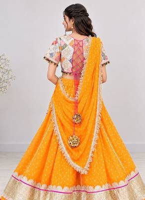 Off white embroidered choli with orange bandhej lehenga set 2