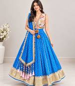 Off white embroidered choli with blue bandhej lehenga set