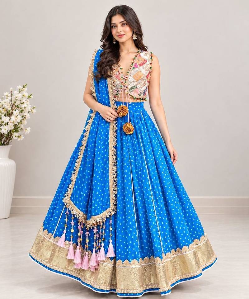 Off white embroidered choli with blue bandhej lehenga set