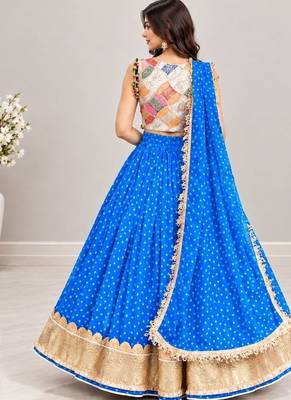 Off white embroidered choli with blue bandhej lehenga set 2