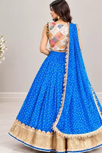 Off white embroidered choli with blue bandhej lehenga set