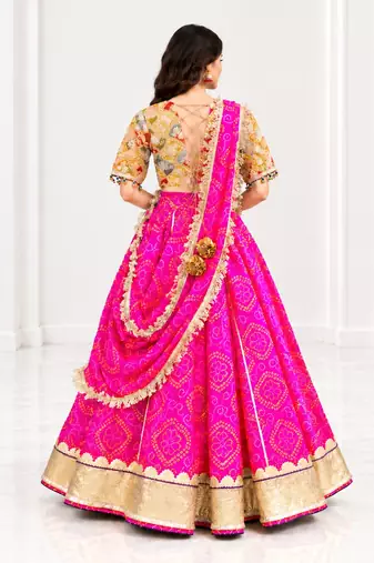Mustard embroidered choli with pink bandhej lehenga set