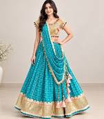 Mustard embroidered choli with aqua green bandhej lehenga set