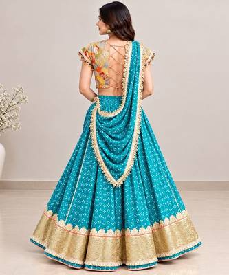 Mustard embroidered choli with aqua green bandhej lehenga set 2