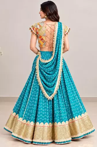 Mustard embroidered choli with aqua green bandhej lehenga set