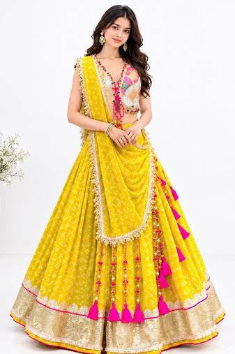 Off white embroidered choli with yellow bandhej lehenga set