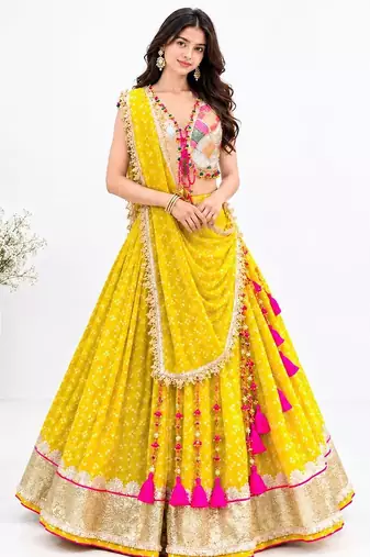 Off white embroidered choli with yellow bandhej lehenga set