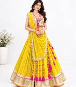 Off white embroidered choli with yellow bandhej lehenga set