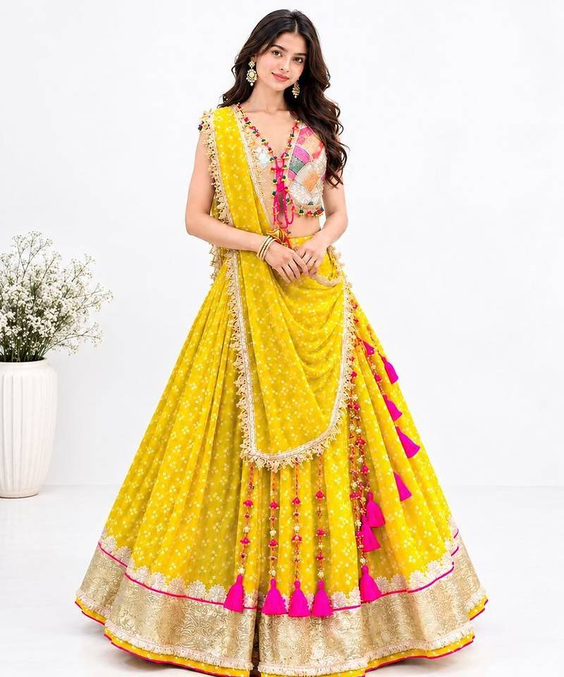 Off white embroidered choli with yellow bandhej lehenga set