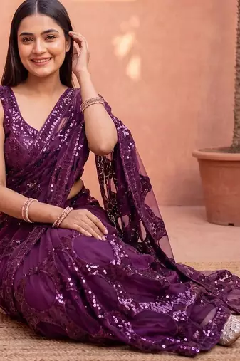 Purple sequinned net designer saree