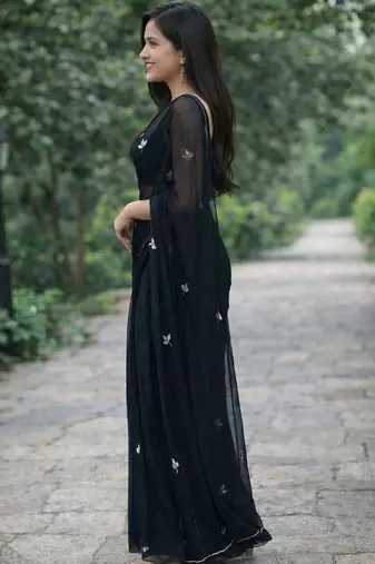 Black solid georgette hand-embroidered floral buttis salli work border sarees