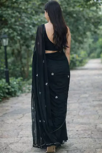 Black solid georgette hand-embroidered floral buttis salli work border sarees