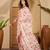 Peach floral printed saree with embellished beads and stones border