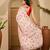 Peach floral printed saree with embellished beads and stones border