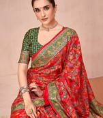 Red ethnic motifs printed festive wear saree with matching unstitched blouse