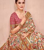 Beige ethnic motifs printed festive wear saree with matching unstitched blouse