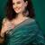 Teal ethnic motifs printed zari saree with unstitched blouse