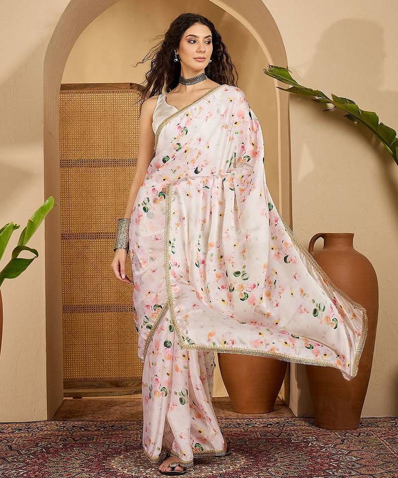 Off white abstract printed saree with embellished border & unstitched blouse