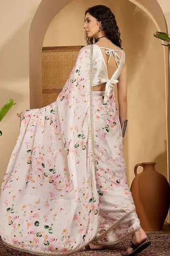Off white abstract printed saree with embellished border & unstitched blouse