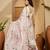 Off white abstract printed saree with embellished border & unstitched blouse