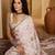 Off white abstract printed saree with embellished border & unstitched blouse