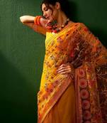 Mustard embroidered net sarees