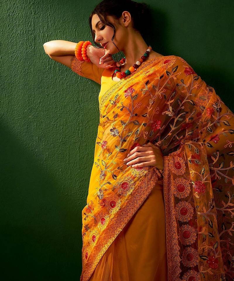 Mustard embroidered net sarees