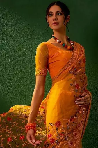 Mustard embroidered net sarees