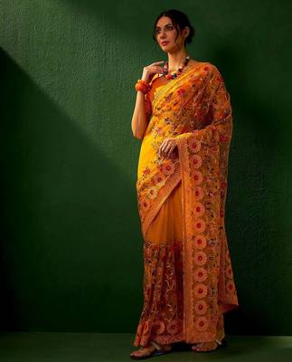 Mustard embroidered net sarees 4