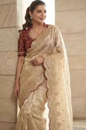 Cream embellished sequinned tissue heavy work saree