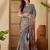 Grey  linen printed sarees with tassels & unstithced blouse piece