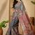 Grey  linen printed sarees with tassels & unstithced blouse piece
