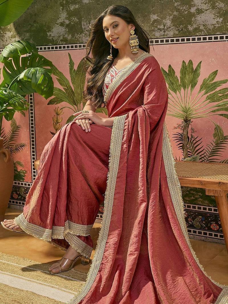 Maroon textured tissue silk saree with embellished border and designer blouse
