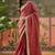 Maroon textured tissue silk saree with embellished border and designer blouse
