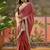 Maroon textured tissue silk saree with embellished border and designer blouse