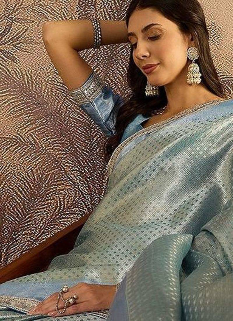 Blue woven design saree with unstitched blouse