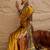 Mustard women mustard printed crepe saree
