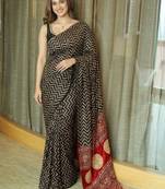 Black ethnic motifs mirror work heavy work saree