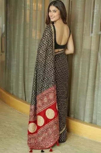 Black ethnic motifs mirror work heavy work saree