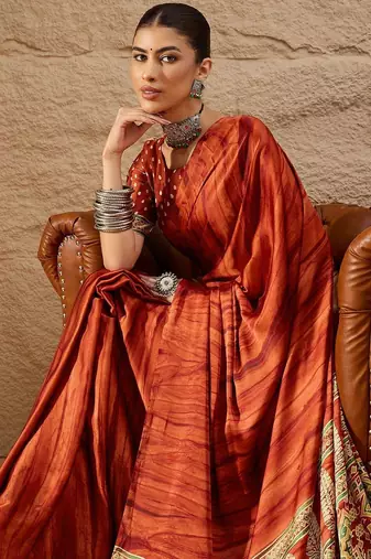 Rust rust crepe ethnic printed party wear saree with matching blouse