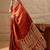 Rust rust crepe ethnic printed party wear saree with matching blouse