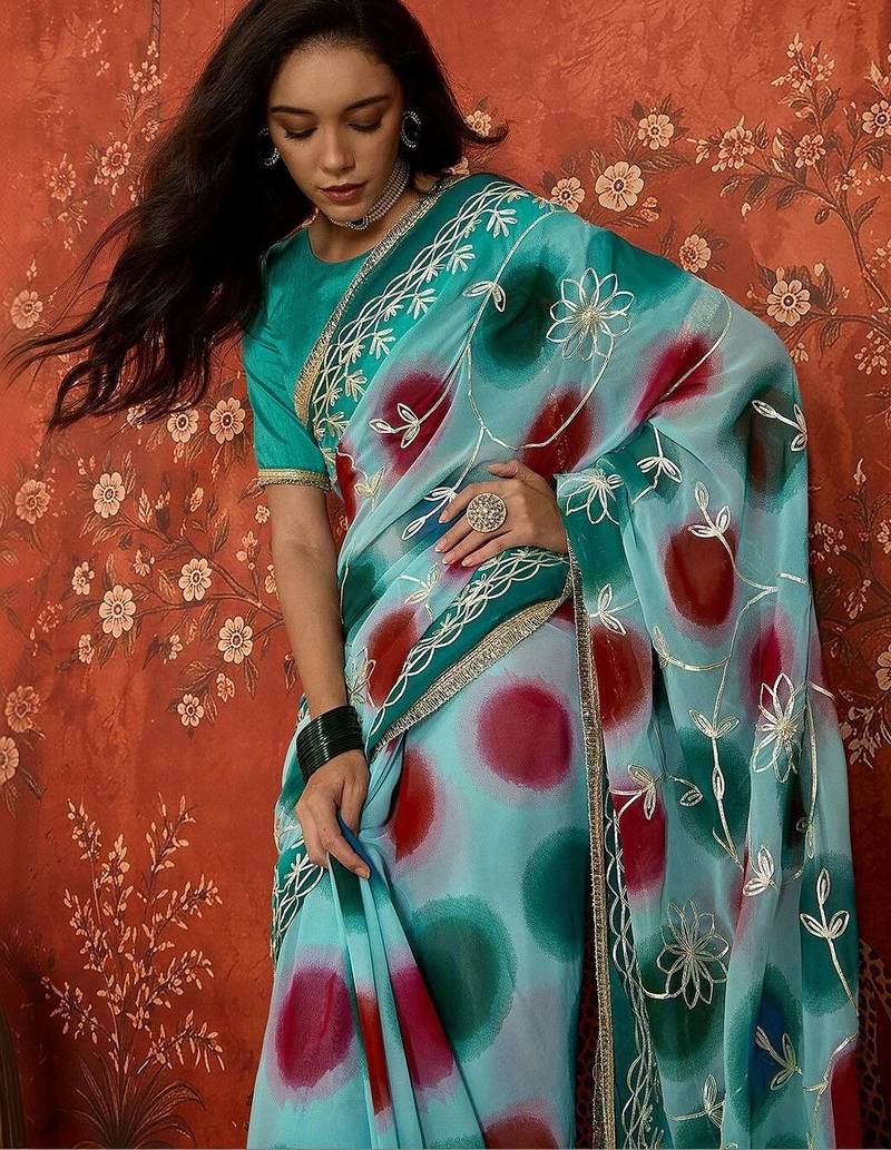 Turquoise embroidered  georgette saree
