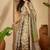 Beige floral printed  linen sarees with tassels & blouse piece