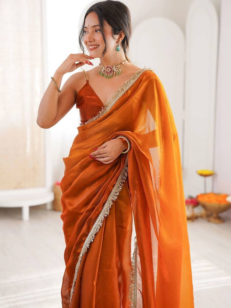 Orange sequinned tissue designer saree