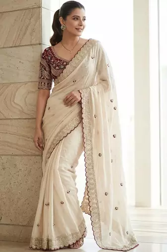 White embellished embroidered sequinned sarees with blouse piece