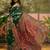 Green woven design saree with unstitched blouse