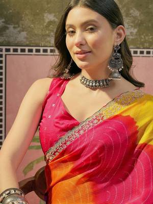 Yellow bandhani printed saree with embellished border and blouse piece 4