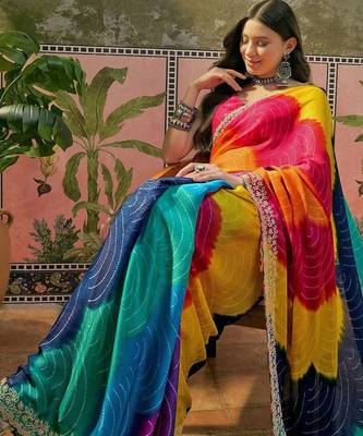 Yellow bandhani printed saree with embellished border and blouse piece 5
