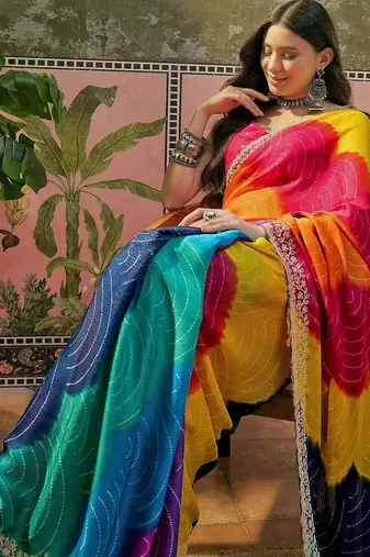 Yellow bandhani printed saree with embellished border and blouse piece