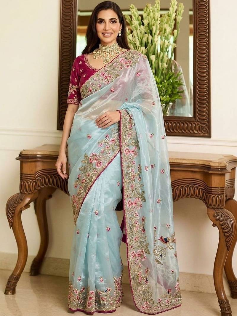 Turquoise embroidered sarees with unstitched blouse piece
